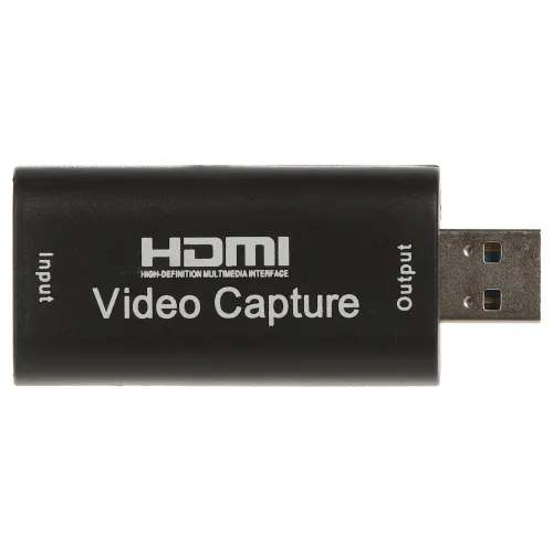 Czarny adapter HDMI Video Capture z wejściem i wyjściem USB, oznaczony białymi napisami. Urządzenie służy do przechwytywania sygnału wideo.