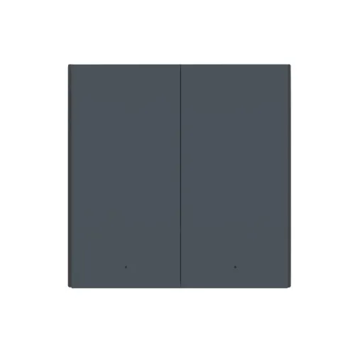 Na zdjęciu znajduje się prostokątny, ciemnoszary panel z dwoma równymi sekcjami, przypominający nowoczesny włącznik światła. Panel ma minimalistyczny design bez widocznych przycisków czy ozdób.