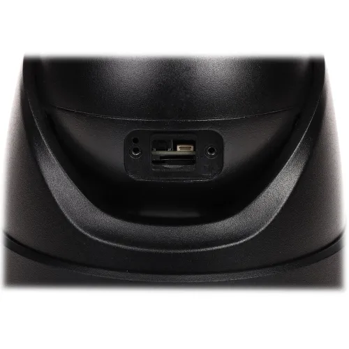 Czarny panel z gniazdem na kartę pamięci i przyciskiem reset umieszczony na zakrzywionej powierzchni. Gniazdo znajduje się centralnie, a przycisk reset jest widoczny obok.