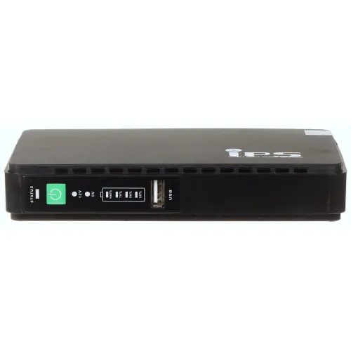 Czarny zasilacz awaryjny z widocznym logo "iPS" na górze, posiadający wskaźnik statusu i port USB na przednim panelu. Urządzenie ma prostokątny kształt z otworami wentylacyjnymi po bokach.